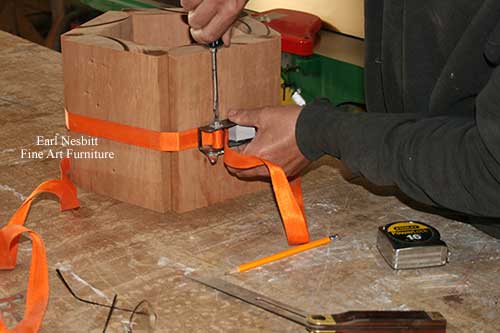 Earl tightens pieces of small custom made jewelry box before glue up